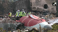 Visuals from crash site show broken tail end, empennage charred BJ hostel building