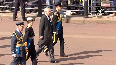 King Charles III joins procession of Queen's coffin in London