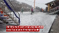 Pilgrims enjoy snowfall near Gurudwara Hemkund Sahib