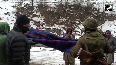 Army troops carry pregnant woman to hospital in biting cold