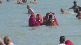Devotees take holy dip in Agni Theertham Sea on occasion of Pongal