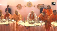 After taking a dip in Sangam, Amit Shah has lunch with Yogi and saints