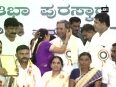 Watch Woman kisses Karnataka CM in public