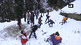 Tourists enjoy snowfall in Kufri
