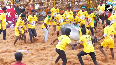 Tamil Nadu Bull-tamers try to grab and hang on to bull in traditional sport Jallikattu Pongal