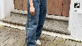 Sanya Malhotra looked very stylish in a short white top and fashionable jeans