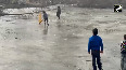 Cricket on ice! Frozen pond turns playground for kids in Sopore