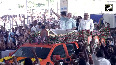 Gujarat PM Modi greets crowd during his roadshow in Surat