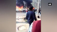 Watch Furious mob ablaze contractor s vehicles after it run over two men