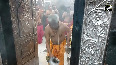 Devotee presents silver ornaments during Bhasma Aarti at Mahakaleshwar Temple in Ujjain