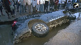 Car falls into pothole caused by heavy waterlogging outside Patna Junction sparking safety concerns