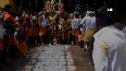 Watch: Devotees walk on burning coal to appease deity