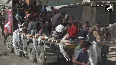 Locals swarm aid trucks in Gaza after ceasefire deal, grab supplies