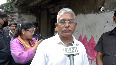 Bengal by-polls Dilip Ghosh paints BJP symbol on walls in Bhabanipur