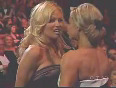 Trish Stratus and Pamela Anderson Kiss