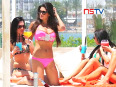 Casey batchelor shows for her toned body in pink bikini