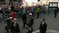 People throng the streets to catch a glimpse of Queen's coffin