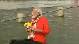 Modi takes a holy dip in Ganga