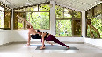 Aashka Goradia and Brent Goble perform yoga together