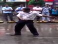 Crazy man dancing in middle of street