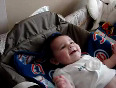 Baby laughing at daddy changing poopy diaper