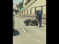 Foolish biker kicks car video