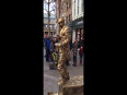 Living bronze statue man act
