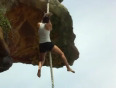 Girl cliff rope climb