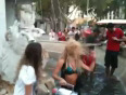 Shakira dances with fans in a fountain