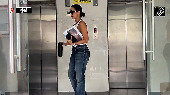 Malaika looks stylish in a white tube top and blue jeans