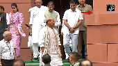Crossing Aisles with a Nod: Rajnath's Moment with Priyanka Gandhi Goes Viral