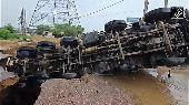 Gurugram road caves in after heavy rain, truck falls into giant crater