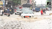 Videos: Heavy rain turns Bhopal road into river