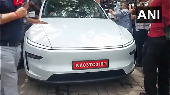Watch: Eknath Shinde drives Tesla outside Vidhan Bhavan in Mumbai