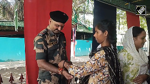 Girls tie rakhi to BSF personnel at India-Pak border