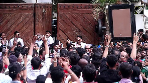Amitabh Bachchan warmly greets fans outside his Mumbai residence