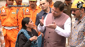 Heartfelt Gesture! Woman tears her 'Dupatta' to tie Rakhi on CM Dhami's wrist