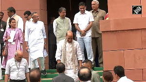 Crossing Aisles with a Nod: Rajnath's Moment with Priyanka Gandhi Goes Viral