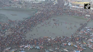 Helicopter showers flower petals on devotees at Maha Kumbh