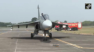 LCA Tejas Mk 1A gets a water cannon salute after its maiden test flight in Nashik