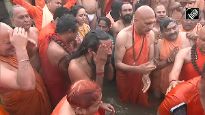 Hema Malini, Baba Ramdev take 'Amrit Snan' on Mauni Amavasya