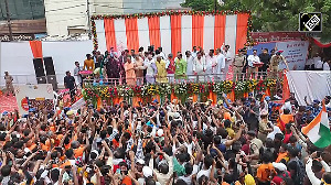 CM Yogi welcomes Kanwariyas with flower showers in Meerut
