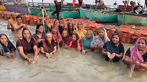 Devotees take a holy dip in sacred Saryu River on occassion of Hartalika Teej 