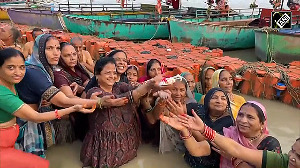 Devotees take a holy dip in sacred Saryu River on occassion of Hartalika Teej 