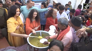 Katrina distributes prasad to devotees at Maha Kumbh