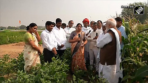PM Modi interacts with farmers as he participates in a special Krishi programme