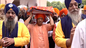 UP CM Yogi carries Sri Guru Granth Sahib ji on 350th Balidan Diwas of Guru Teg Bahadur Ji
