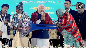 PM Modi hands over keys to beneficiaries of newly constructed flats for the dwellers of JJ clusters