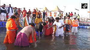 Devendra Fadnavis, wife Amruta take holy dip in Triveni Sangam