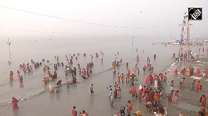 Devotees take holy dip in Ganga in Gangasagar on Makar Sankranti